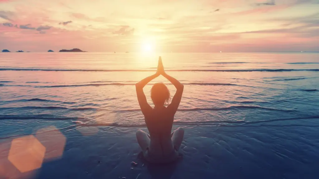 Woman yoga photo on a beautiful beach in Salt Lake City, UT | Santosh Yoga Institute