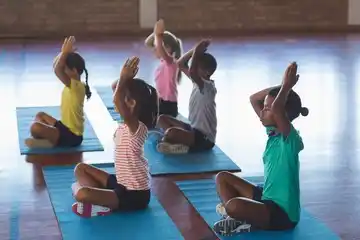 Group of kids practices yoga together in Salt Lake City, UT | Santosh Yoga Institute