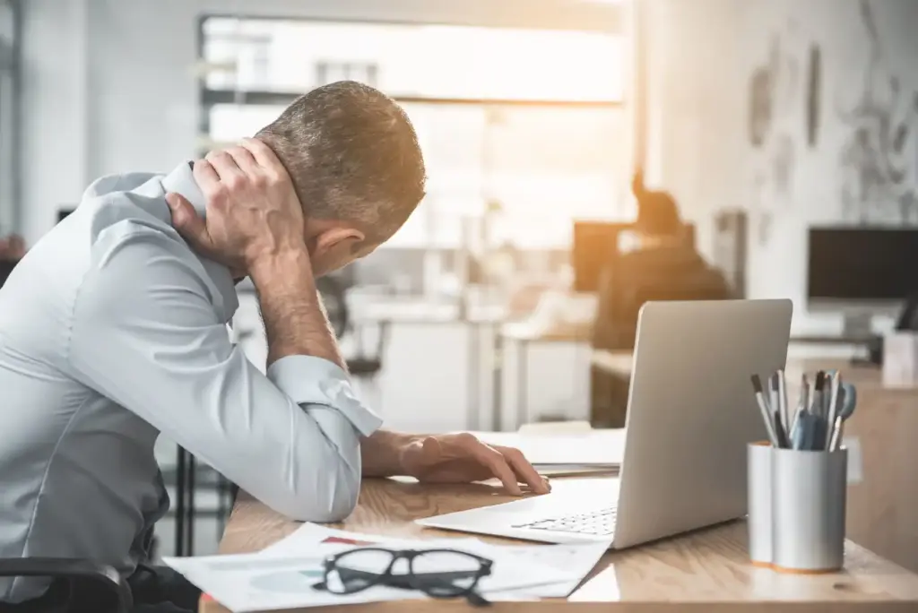 Stressed man in office Photo in Salt Lake City, UT | Santosh Yoga Institute