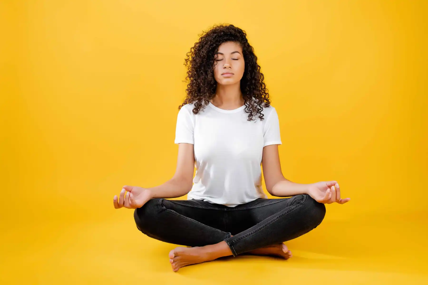 Young girl doing meditation in Salt Lake City, UT | Santosh Yoga Institute