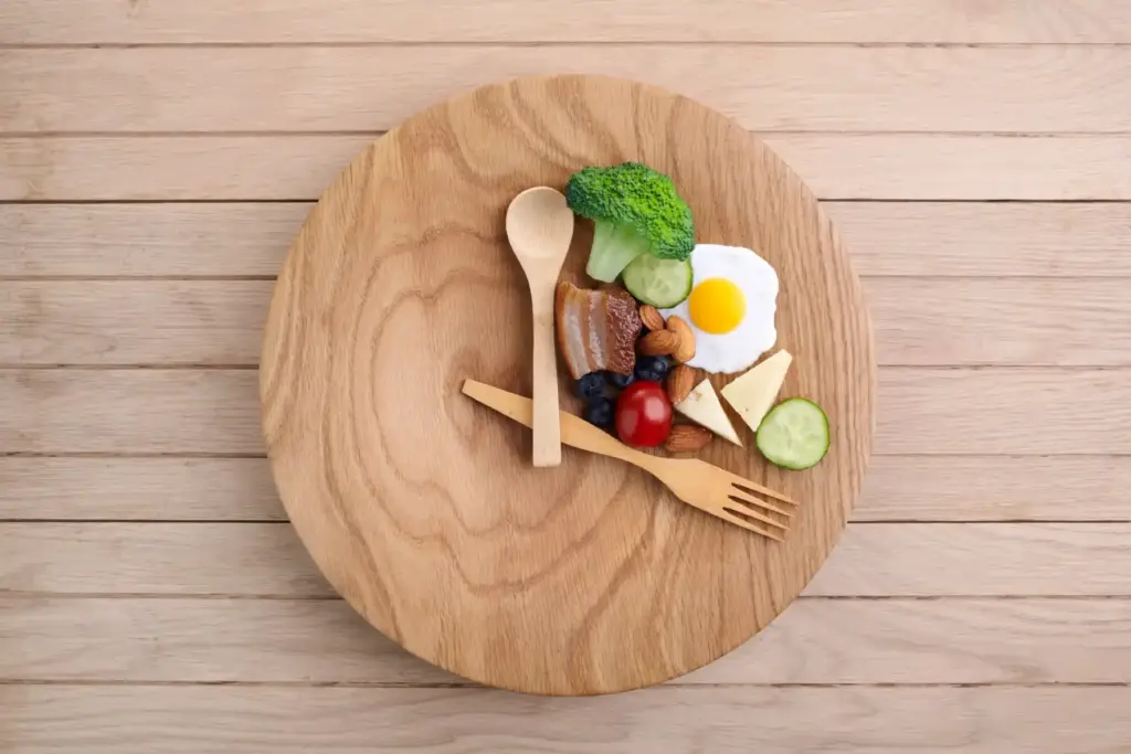Healthy food clock. in wooden table in Salt Lake City, UT | Santosh Yoga Institute