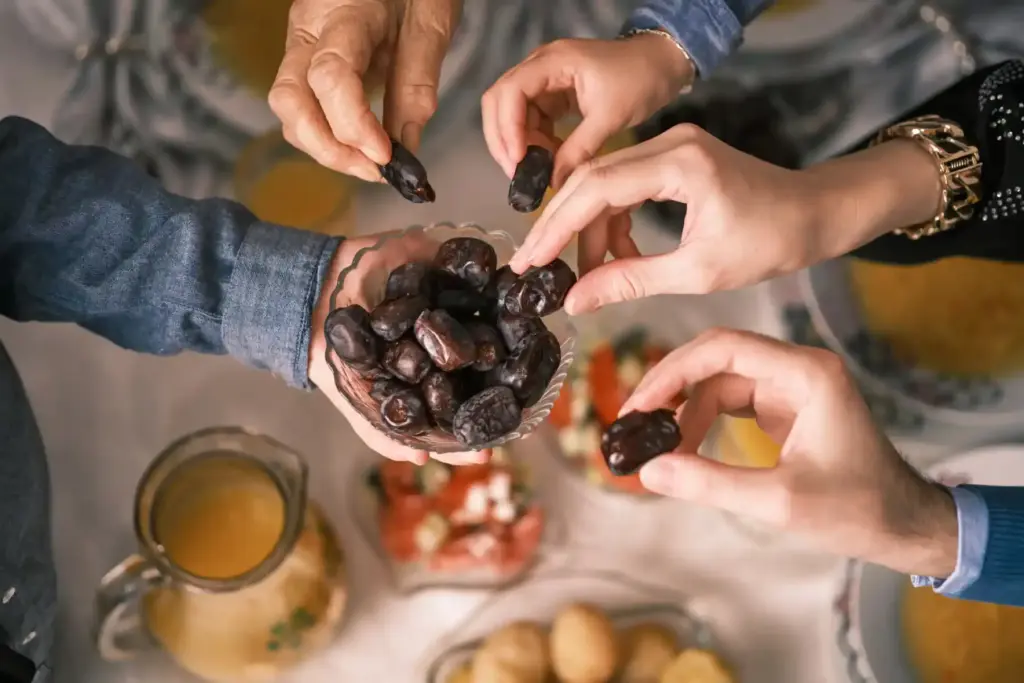 People hands sharing food in Salt Lake City, UT | Santosh Yoga Institute