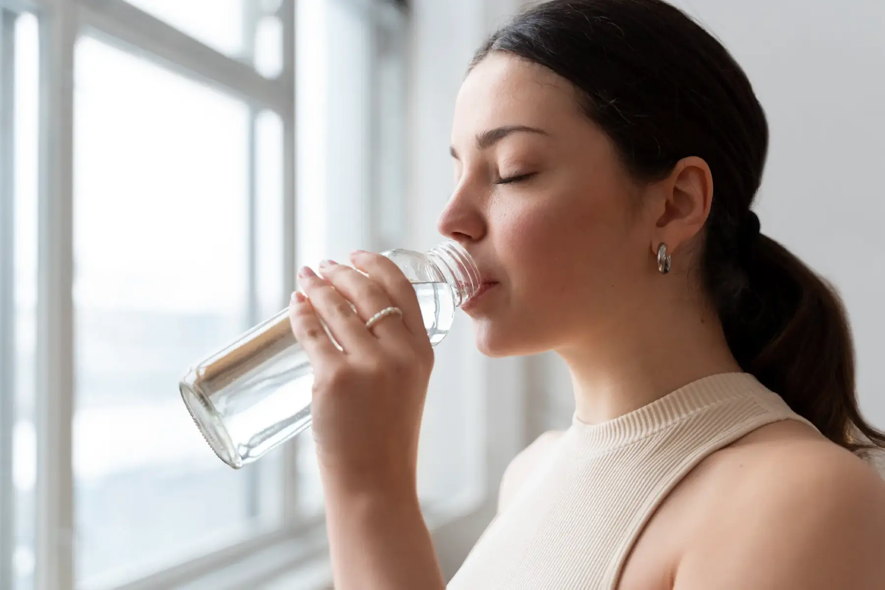 Young girl drinking water in Salt Lake City, UT | Santosh Yoga Institute
